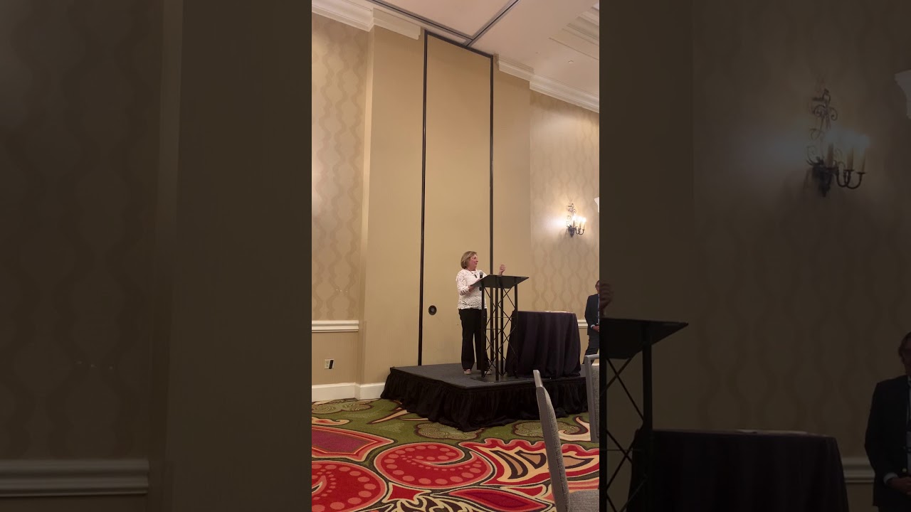 Deborah Masucci accepts the James F Henry Award for Outstanding Achievement in ADR